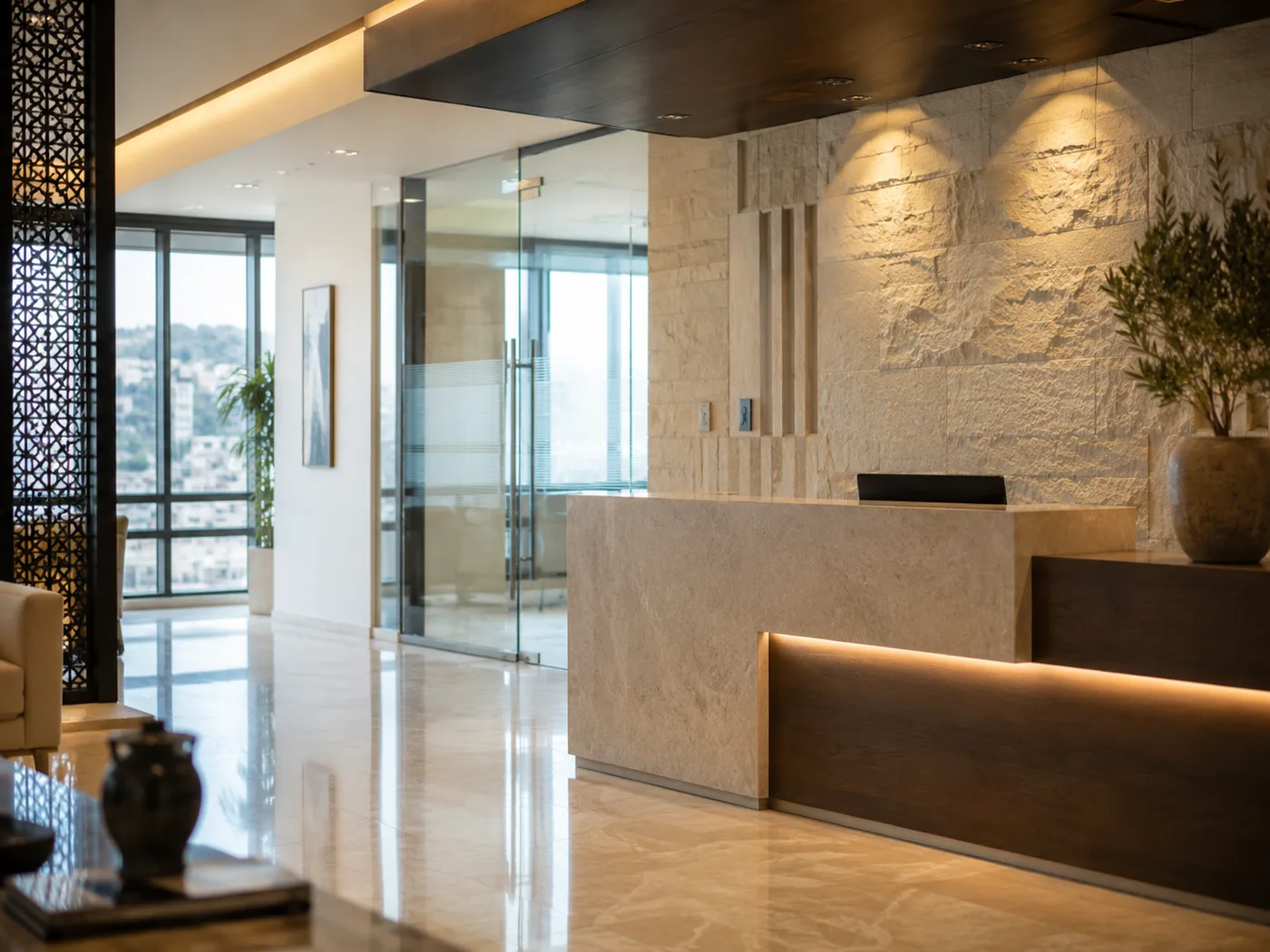HCC's Amman office reception — stone feature wall with the HCC seal