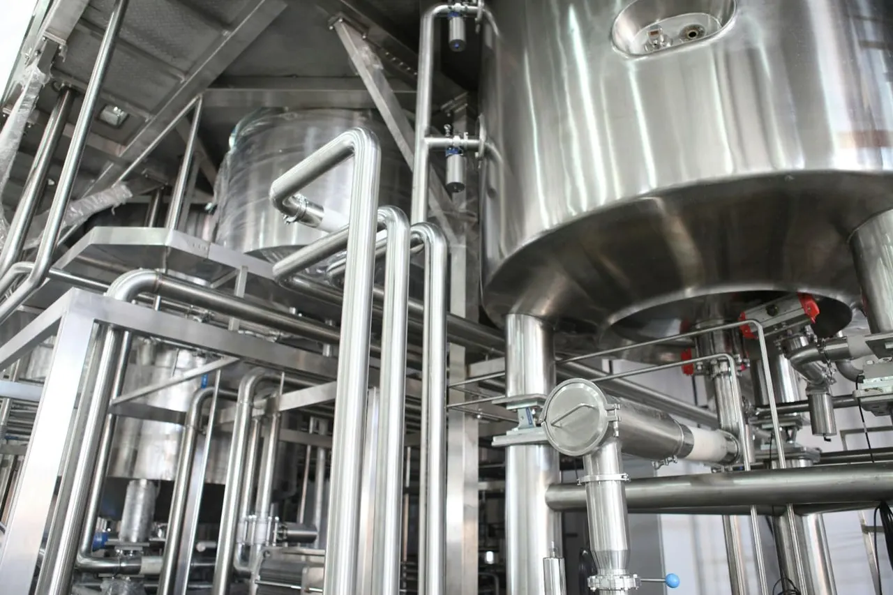 Stainless-steel processing equipment in a modern production facility